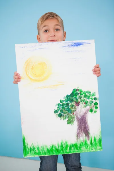 Boy showing his painting in classroom — Stock Photo, Image