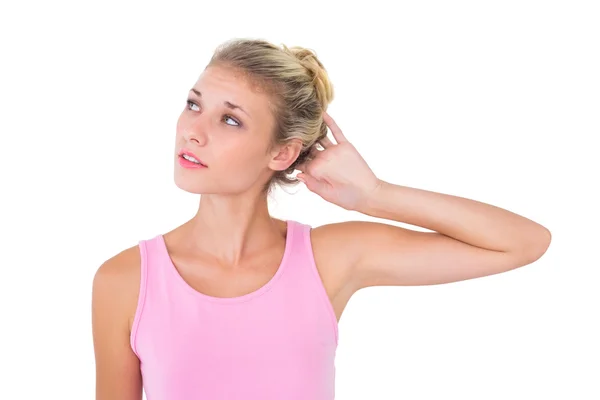 Pretty young blonde in pink looking up — Stock Photo, Image