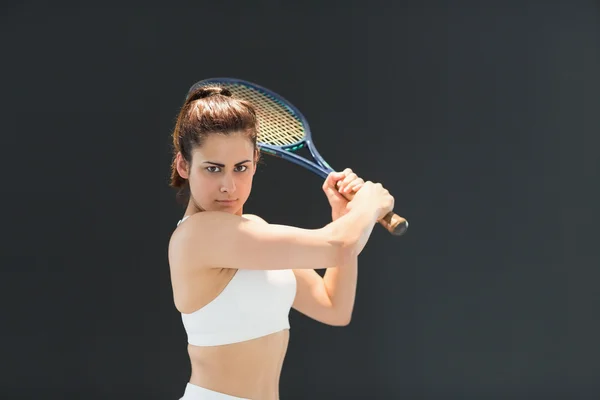 Portrait of confident female tennis player with racquet — Stock Photo, Image