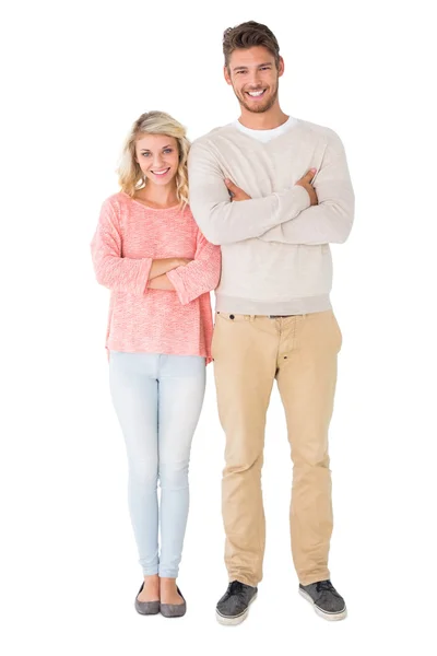 Attractive couple smiling with arms crossed — Stock Photo, Image