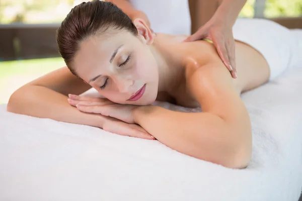 Attractive woman receiving back massage at spa center — Stock Photo, Image