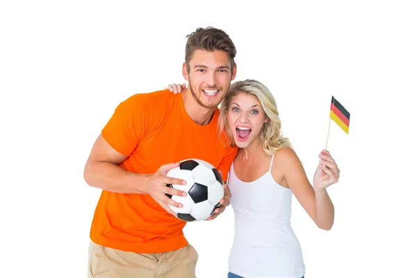 Excited football fan couple smiling at camera — Stock Photo, Image