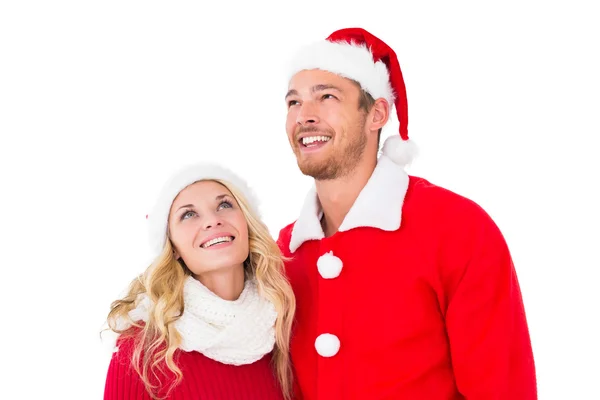 Casal festivo sorrindo e olhando para cima — Fotografia de Stock