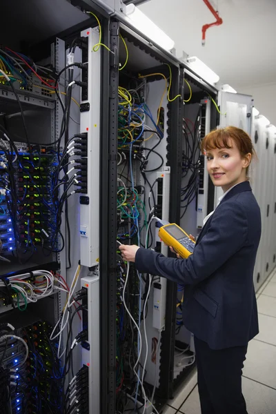 Happy technician using digital cable — Stock Photo, Image