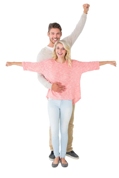 Casal atraente sorrindo e aplaudindo — Fotografia de Stock