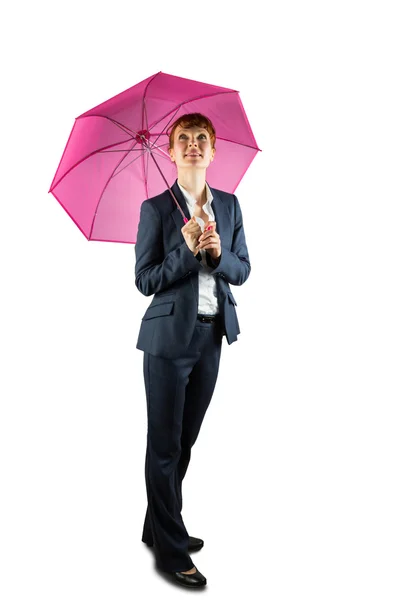 Smiling businesswoman holding pink umbrella — Stock Photo, Image