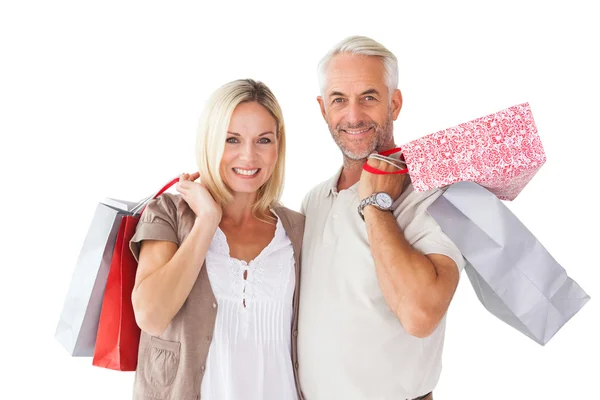 Feliz pareja sosteniendo bolsas de compras —  Fotos de Stock