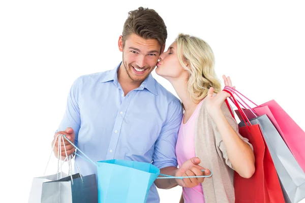 Attractive young couple holding shopping bags Stock Photo