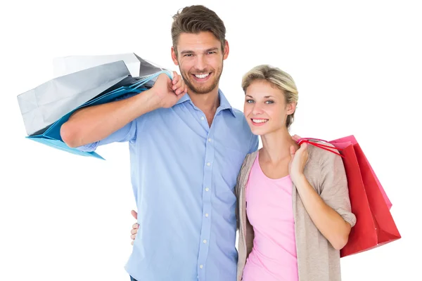 Attractive young couple holding shopping bags Royalty Free Stock Images