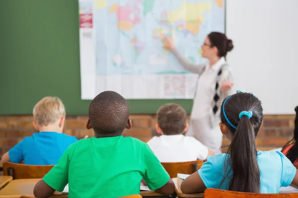 Teacher giving a geography lesson Stock Image