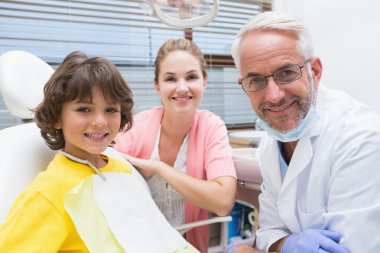 Boy with mother and dentist clipart