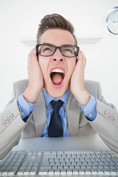 Angry businessman working on computer — Stock Photo, Image