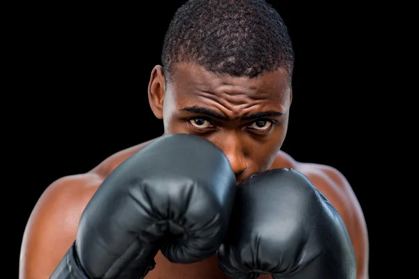 Shirtless muscular boxer in defensive stance — Stock Photo, Image