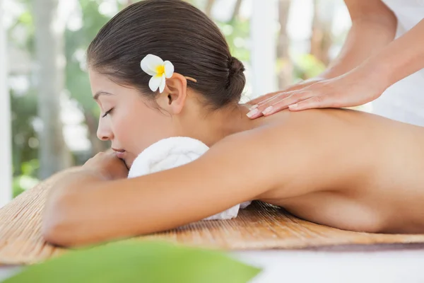 Beautiful brunette enjoying massage — Stock Photo, Image