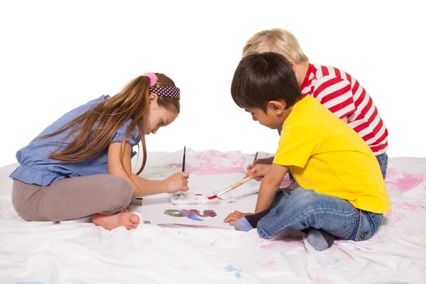 Little children painting on the floor — Stock Photo, Image