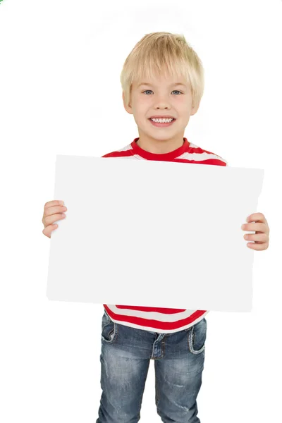 Liten gutt som viser hvit side – stockfoto
