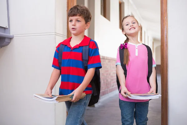 Cute pupils walking into classroom — Stock Photo, Image