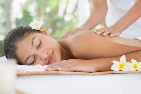 Beautiful brunette enjoying shoulder massage — Stock Photo, Image