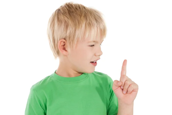 Sorprendido niño apuntando hacia arriba — Foto de Stock