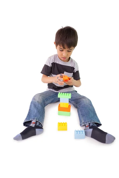 Little boy playing with building blocks — Stock Photo, Image