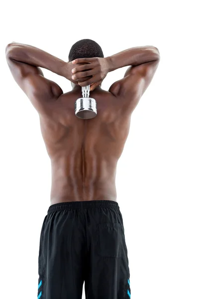 Fit man lifting dumbbell — Stock Photo, Image