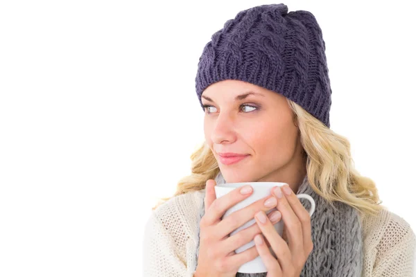 Pretty blonde in winter fashion holding mug — Stock Photo, Image