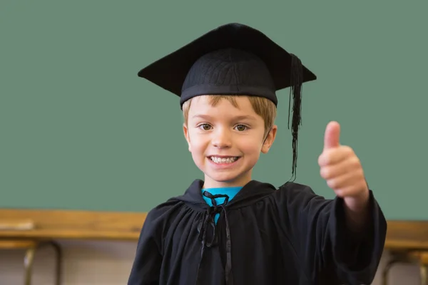 Pupil in graduation robe in classroom — Stock Photo, Image