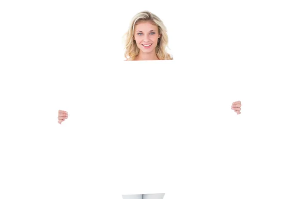 Pretty young blonde showing poster — Stock Photo, Image