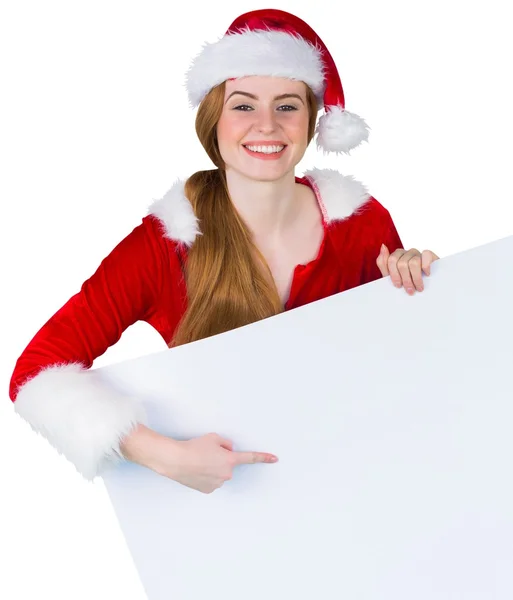 Bella ragazza in costume da Babbo Natale mostrando carta — Foto Stock
