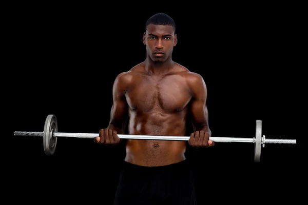 Serious fit man lifting barbell — Stock Photo, Image