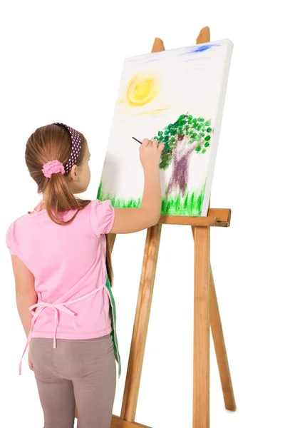 Little girl painting on easel — Stock Photo, Image