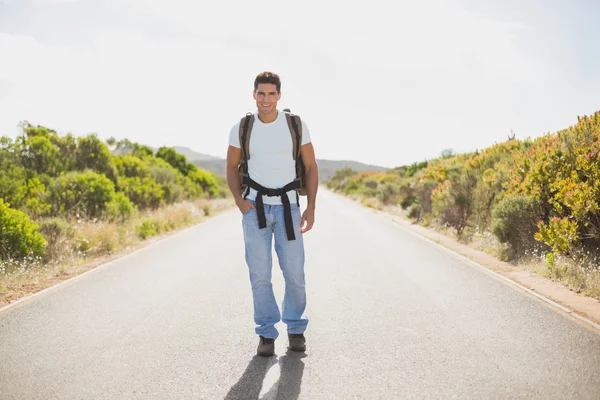 Hiking man walking on countryside road — Stock Photo, Image