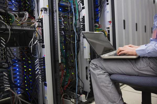 Technician sitting on swivel chair — Stock Photo, Image