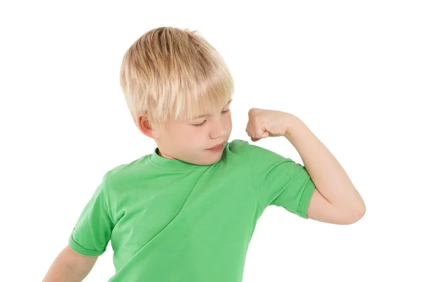 Cute little boy flexing his arm — Stock Photo, Image