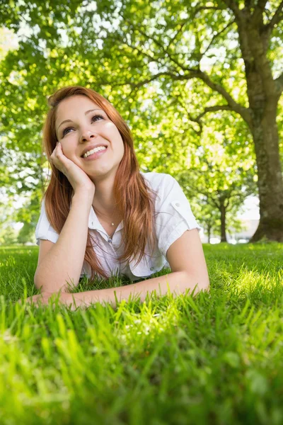 Pretty redhead relaxing in the park — Stock Photo, Image