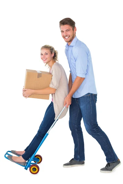 Young couple having fun on moving trolley — Stock Photo, Image
