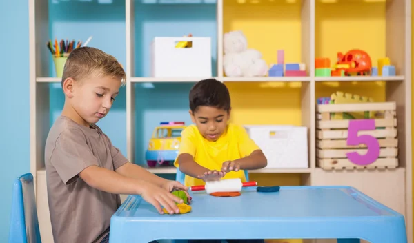 Boys playing with modelling clay — Stock Photo, Image