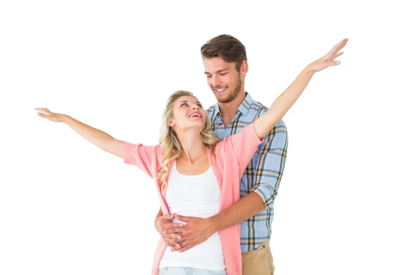 Attractive young couple smiling and embracing — Stock Photo, Image