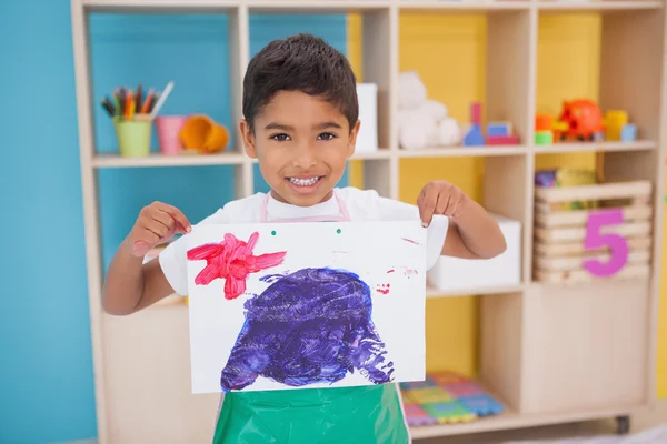 Little boy showing his painting in classroom — Stock Photo, Image