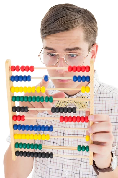 Nerdy hipster lägga på abacus — Stockfoto