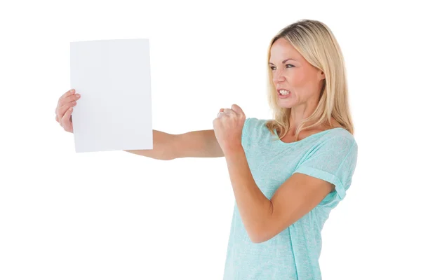 Angry woman holding piece of paper — Stock Photo, Image