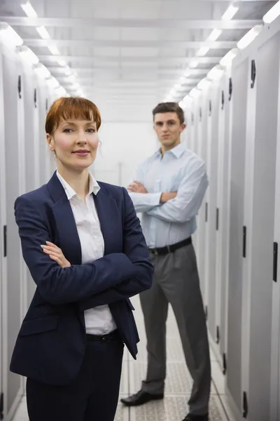 Team of computer technicians looking at camera — Stock Photo, Image