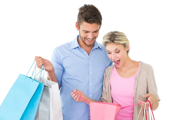 Attractive young couple holding shopping bags Royalty Free Stock Photos