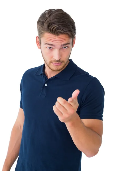 Handsome young man pointing at camera Stock Picture