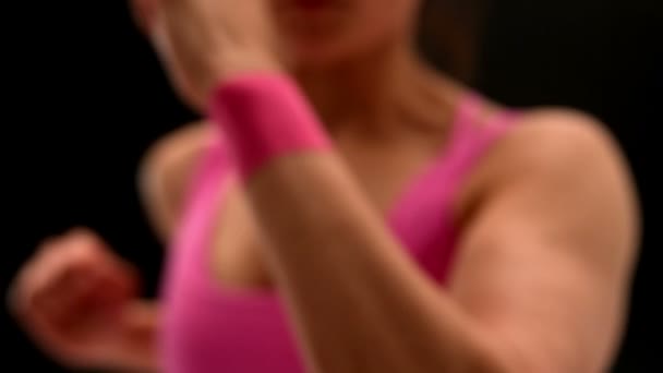 Fit young woman punching at camera — Stock Video