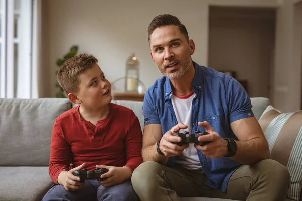 Caucasian Father Son Playing Video Games Together Sitting Couch Home — Stock Photo, Image
