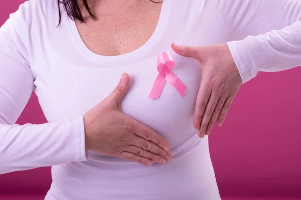 Midsection Woman White Tshirt Pink Ribbon Gesturing Breast Cancer Positive — Stock Photo, Image