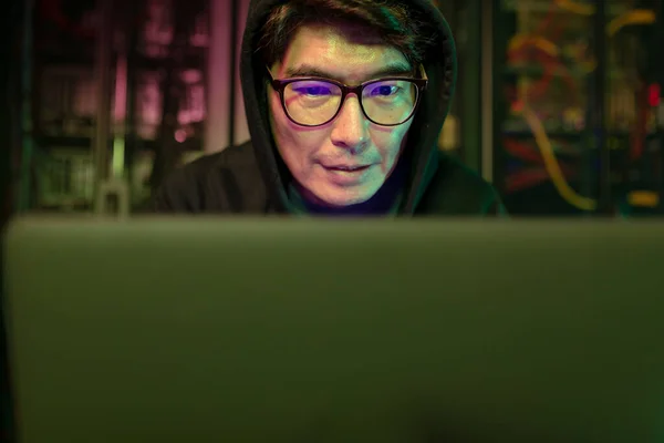 Asian Male Hacker Using Laptop Computer Server Room Cyber Crime — Stock Photo, Image