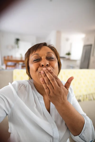 Happy African American Senior Woman Blowing Kiss Video Call Home — Stockfoto