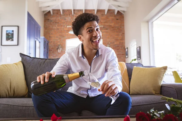Cheerful Young Man Pouring Champagne Flute Virtual Date Home Lifestyle — Stock fotografie